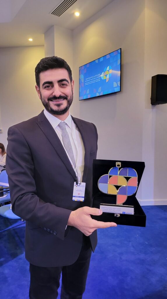 Anthony Abi Zeid with his trophy at UNESCO regional conference about innovation in ECCE